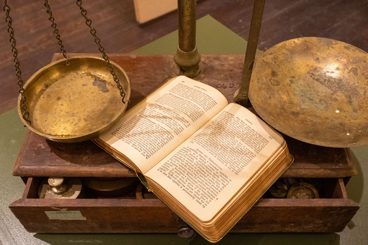 Scales and open medical book